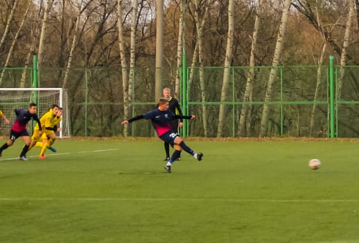 Russia, Volgodonsk - may 17, 2015: Football game. Training matches junior teams and fans
