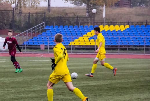 Russia, Volgodonsk - may 17, 2015: Football game. Training matches junior teams and fans