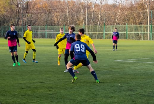 Russia, Volgodonsk - may 17, 2015: Football game. Training matches junior teams and fans