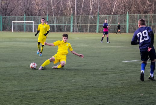 Russia, Volgodonsk - may 17, 2015: Football game. Training matches junior teams and fans