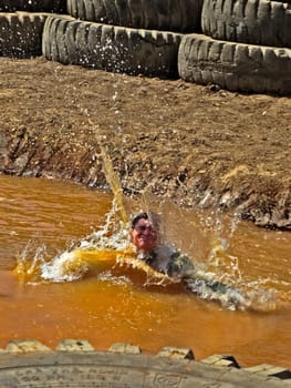 Obstacle. Man overcomes a large puddle.