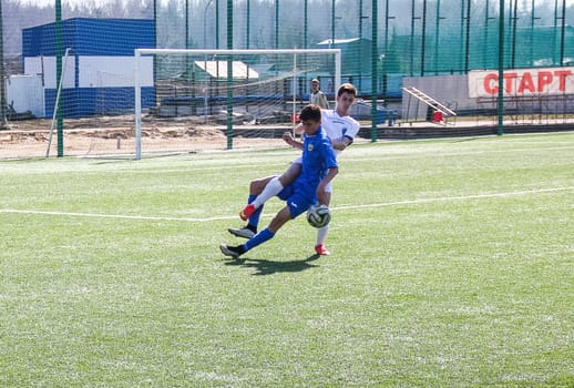 Russia, Volgodonsk - may 17, 2015: Football game. Training matches junior teams and fans