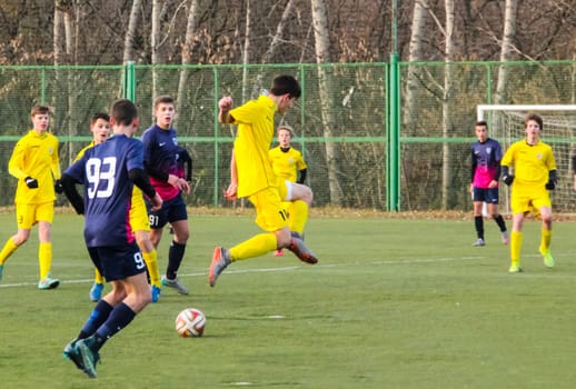 Russia, Volgodonsk - may 17, 2015: Football game. Training matches junior teams and fans