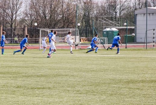 Russia, Volgodonsk - may 17, 2015: Football game. Training matches junior teams and fans