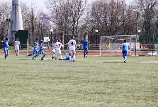 Russia, Volgodonsk - may 17, 2015: Football game. Training matches junior teams and fans