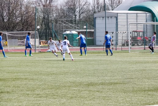 Russia, Volgodonsk - may 17, 2015: Football game. Training matches junior teams and fans