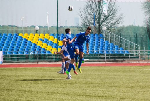 Russia, Volgodonsk - may 17, 2015: Football game. Training matches junior teams and fans