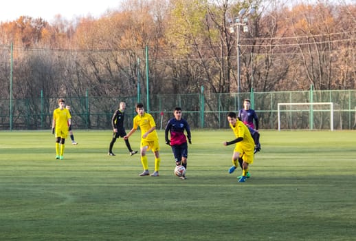 Russia, Volgodonsk - may 17, 2015: Football game. Training matches junior teams and fans