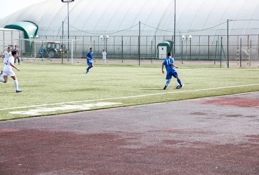 Russia, Volgodonsk - may 17, 2015: Football game. Training matches junior teams and fans