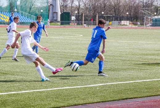 Russia, Volgodonsk - may 17, 2015: Football game. Training matches junior teams and fans