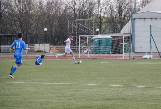 Russia, Volgodonsk - may 17, 2015: Football game. Training matches junior teams and fans