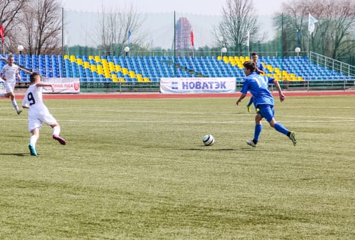 Russia, Volgodonsk - may 17, 2015: Football game. Training matches junior teams and fans