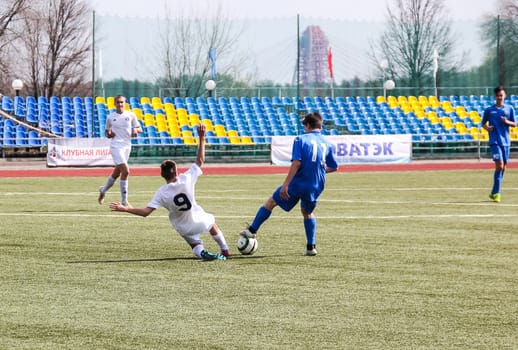 Russia, Volgodonsk - may 17, 2015: Football game. Training matches junior teams and fans