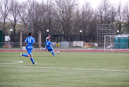 Russia, Volgodonsk - may 17, 2015: Football game. Training matches junior teams and fans