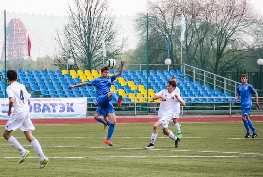 Russia, Volgodonsk - may 17, 2015: Football game. Training matches junior teams and fans