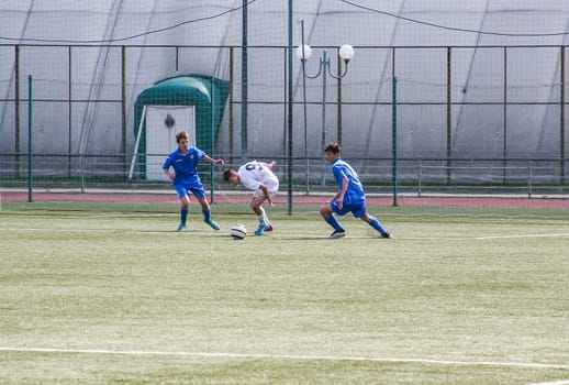 Russia, Volgodonsk - may 17, 2015: Football game. Training matches junior teams and fans