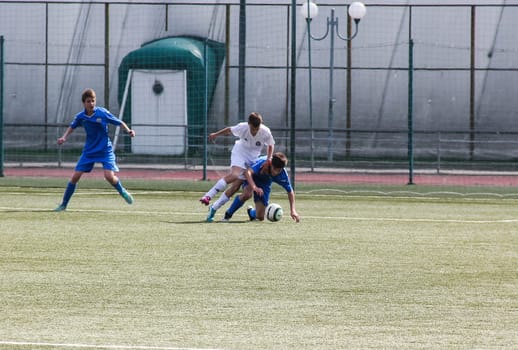 Russia, Volgodonsk - may 17, 2015: Football game. Training matches junior teams and fans