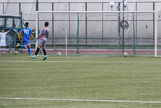 Russia, Volgodonsk - may 17, 2015: Football game. Training matches junior teams and fans