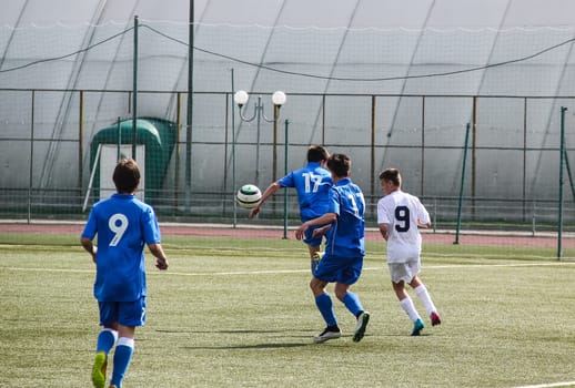 Russia, Volgodonsk - may 17, 2015: Football game. Training matches junior teams and fans