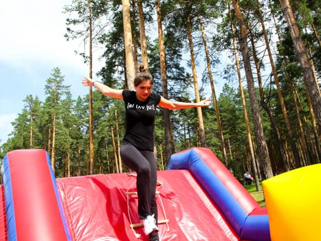 Jumping on the inflatable slides. Children's attraction.