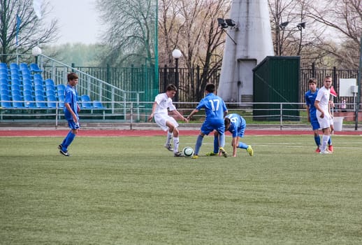Russia, Volgodonsk - may 17, 2015: Football game. Training matches junior teams and fans