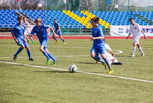 Russia, Volgodonsk - may 17, 2015: Football game. Training matches junior teams and fans