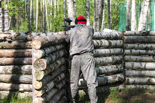 Russia, Volgodonsk - June 30, 2015: Paintball. Shooting competition of weapons with paint balls. Forest tournament