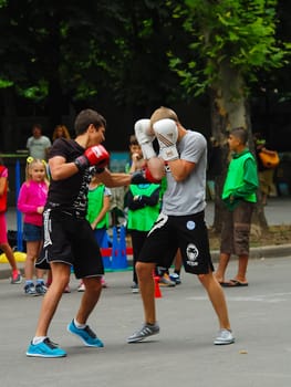 Boxing. Mens are trained in sparring.