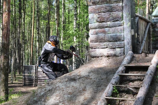 Russia, Volgodonsk - June 30, 2015: Paintball. Shooting competition of weapons with paint balls. Forest tournament