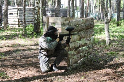 Russia, Volgodonsk - June 30, 2015: Paintball. Shooting competition of weapons with paint balls. Forest tournament