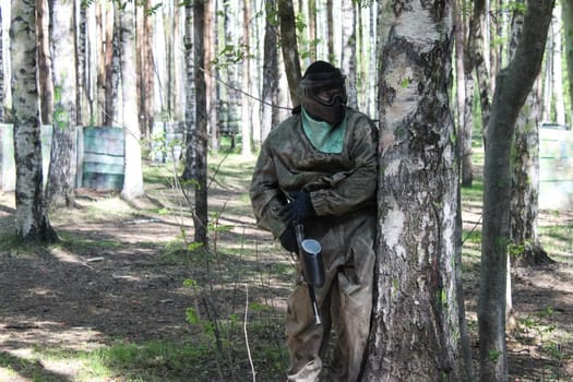 Russia, Volgodonsk - June 30, 2015: Paintball. Shooting competition of weapons with paint balls. Forest tournament