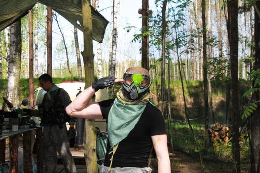 Russia, Volgodonsk - June 30, 2015: Paintball. Shooting competition of weapons with paint balls. Forest tournament