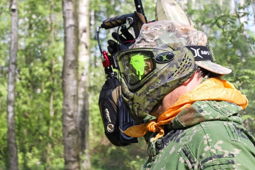 Russia, Volgodonsk - June 30, 2015: Paintball. Shooting competition of weapons with paint balls. Forest tournament