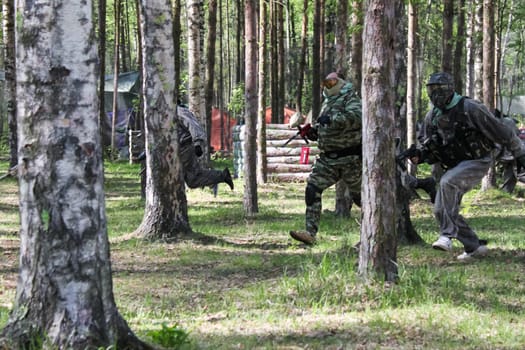 Russia, Volgodonsk - June 30, 2015: Paintball. Shooting competition of weapons with paint balls. Forest tournament