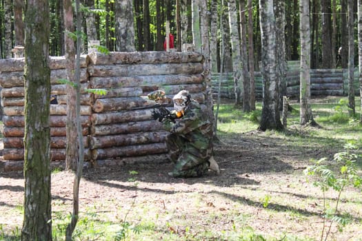 Russia, Volgodonsk - June 30, 2015: Paintball. Shooting competition of weapons with paint balls. Forest tournament