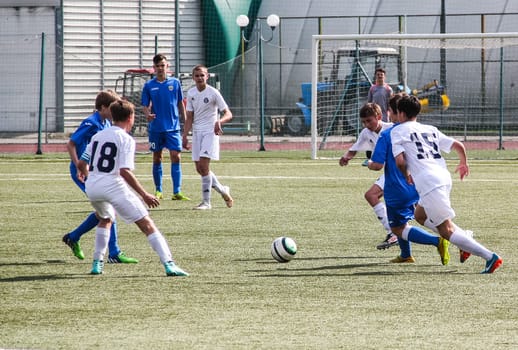Russia, Volgodonsk - may 17, 2015: Football game. Training matches junior teams and fans