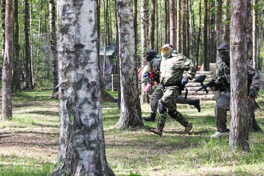 Russia, Volgodonsk - June 30, 2015: Paintball. Shooting competition of weapons with paint balls. Forest tournament