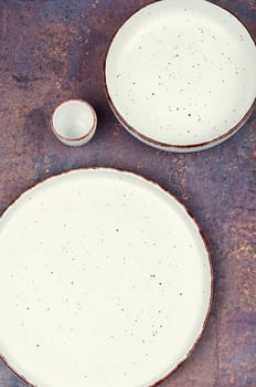 Empty ceramic plates on the table. Card or menu template. Tableware, crockery. Top view.