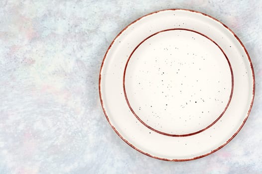 Empty ceramic plates on the table. Card or menu template. Tableware, crockery. Top view.