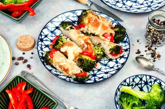 Meat rolls or roulades stuffed with broccoli and peppers. Meat with vegetable filling.