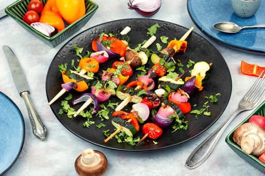 Vegetable juicy skewers, grilled vegetables or barbecue vegetables on wooden skewers. Summer barbecue food.