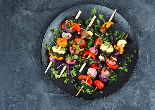 Vegetable juicy skewers, grilled vegetables or barbecue vegetables on wooden skewers. Summer barbecue food.