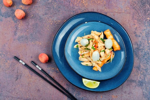 Tasty salad with peeled lychee and chicken breast. Healthy salad.