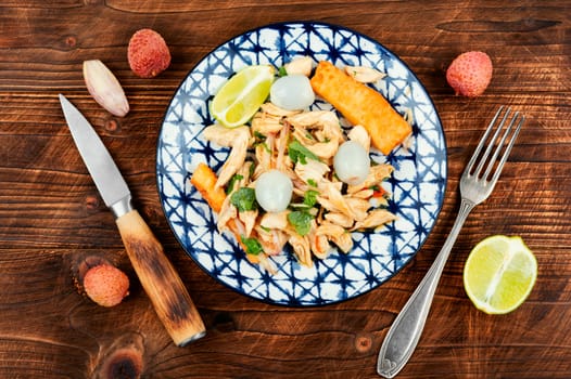 Tasty salad with peeled lychee and chicken breast. Healthy salad.