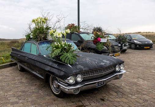 Noordwijk, Netherlands - April 22, 2023: Cars decorated with flowers taking part in the Bloemencorso Bollenstreek the annual spring flower parade from Noordwijk to Haarlem in the Netherlands.