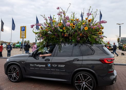 Noordwijk, Netherlands - April 22, 2023: Cars decorated with flowers taking part in the Bloemencorso Bollenstreek the annual spring flower parade from Noordwijk to Haarlem in the Netherlands.