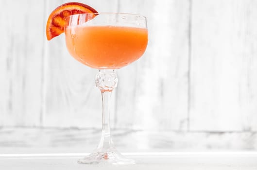 Succulent Blood Cocktail garnished with orange wheel