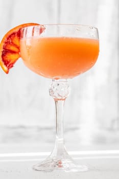Succulent Blood Cocktail garnished with orange wheel