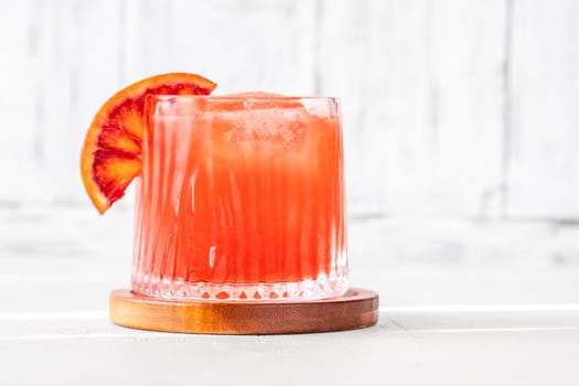 Sanguinello Cocktail garnished with blood orange wheel