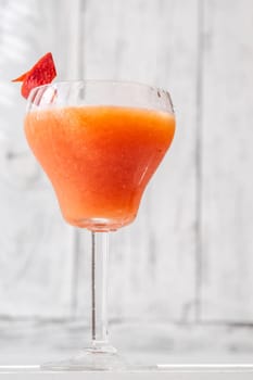 Bloody Bronx Cocktail garnished with blood orange zest